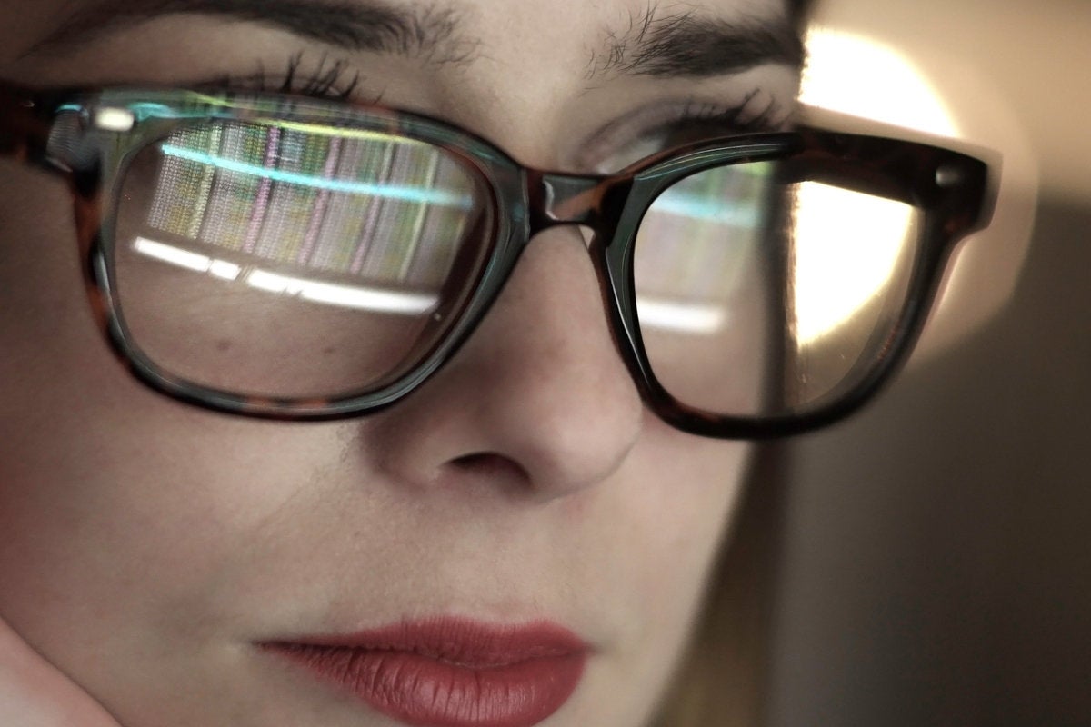 woman studying programmer code glasses lipstick gender equality